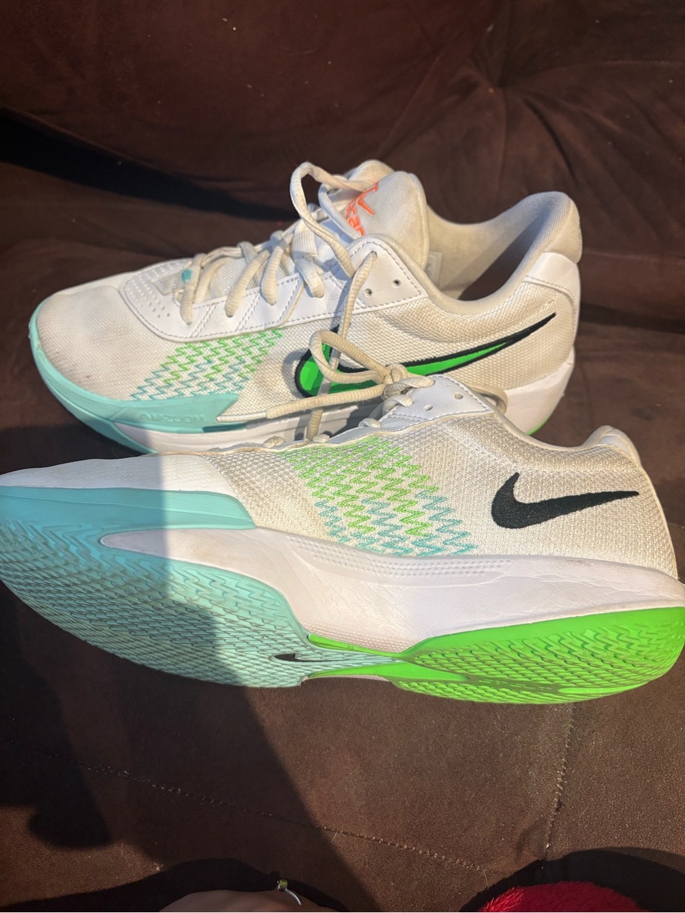 Nike White Athletic Shoes with Black Swoosh and Green Accents